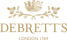 Image shows the Debrett's logo which consists of a crown above a horizontal wreath with the text 'Debrett's' underneath and 'London 1769' on another line. All elements of the logo are gold.